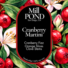 Load image into Gallery viewer, “Candle label with a cranberry and floral background, featuring a black oval that reads Cranberry Martini with notes of cranberry fizz, orange slices, and clove stems.”
