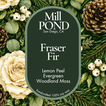 Load image into Gallery viewer, “Green candle label reading Fraser Fir, surrounded by pinecones, evergreen branches, cream roses, and green leaves.”
