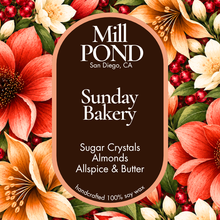 Load image into Gallery viewer, A square product label design for Mill Pond Candle Co., featuring a central dark brown oval with white text reading 'Sunday Bakery' and scent details, surrounded by a border of red, orange, and cream flowers with green leaves and red berries.
